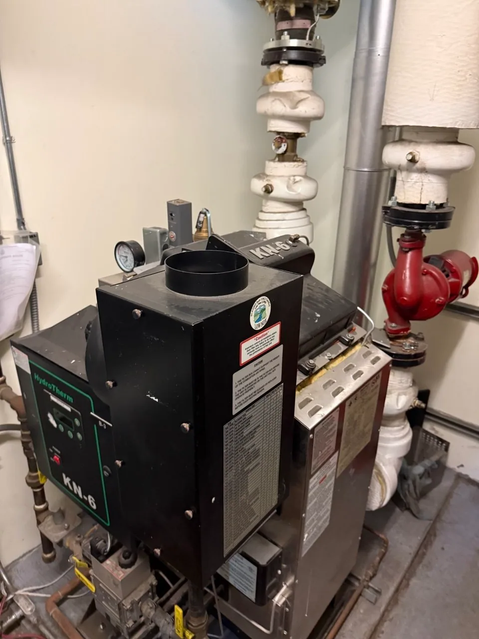 Commercial boiler installed in a building mechanical room