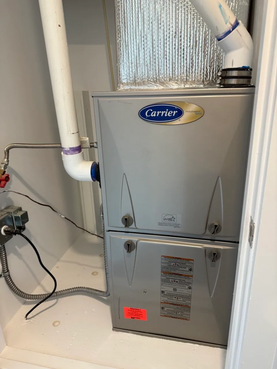 Carrier furnace installed in an interior utility closet