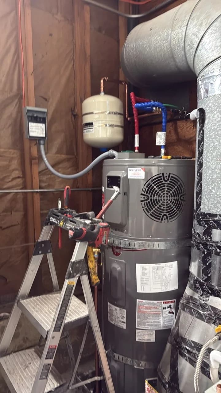 Heat pump water heater installed with expansion tank and piping