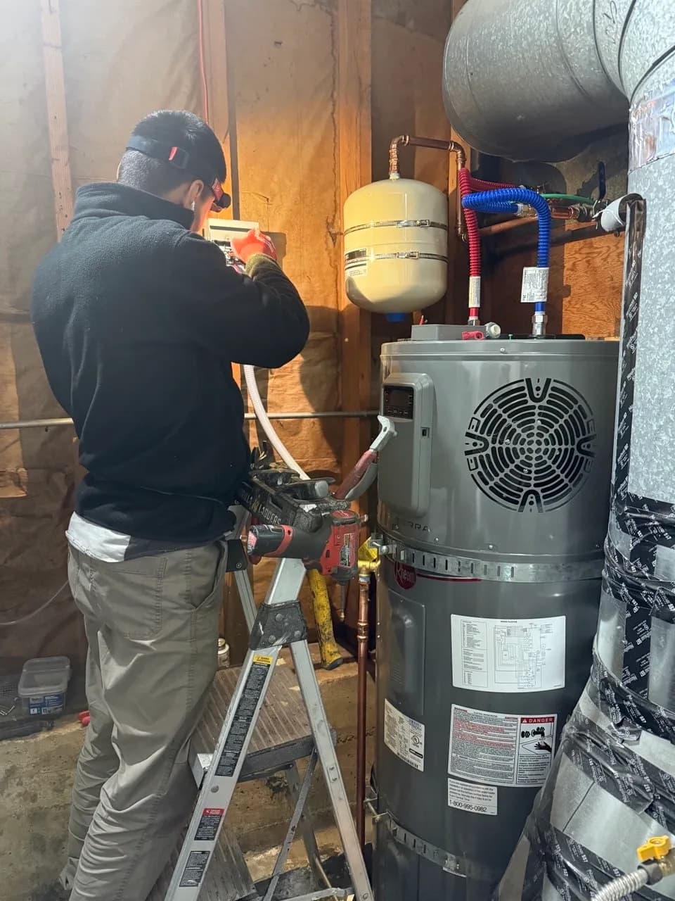 Rheem heat pump water heater in a residential mechanical room