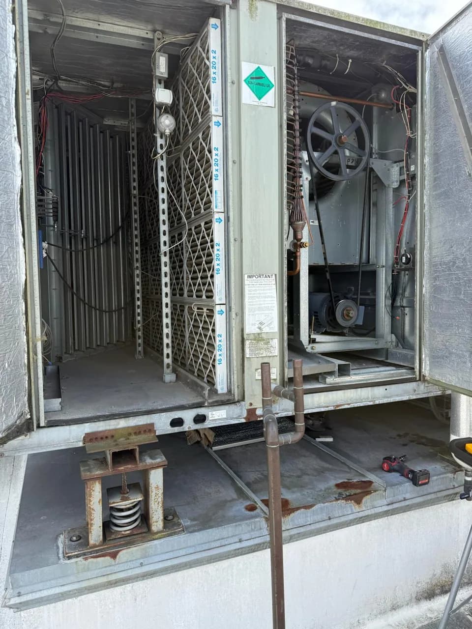 Rooftop unit coil with the access doors opened for service