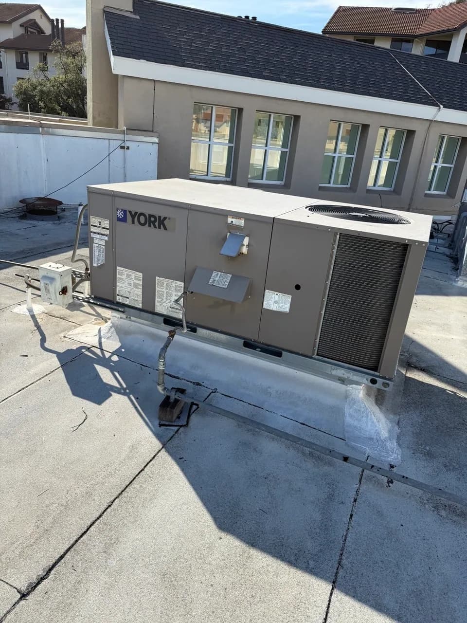 YORK packaged rooftop unit installed on a flat commercial roof